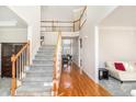 Bright foyer with hardwood floors, staircase, and open view to the living spaces at 3735 Holiday Lane Ln, Atlanta, GA 30349