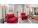 Cozy sitting area with bright windows, neutral walls and comfortable furniture at 3735 Holiday Lane Ln, Atlanta, GA 30349