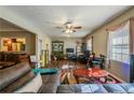 Spacious living room with hardwood floors, comfortable seating, and ample natural light at 600 Green Mountain Trl, College Park, GA 30349