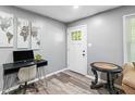 Inviting entryway featuring stylish decor, wood-look floors, and ample natural light from the front door at 2150 Meadowlane Dr, Atlanta, GA 30311