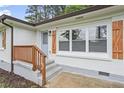 Up close view of the front entrance, updated windows, shutters and new paint at 2478 Graywall St, Atlanta, GA 30344