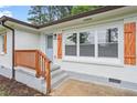 Close-up view of the house entrance, featuring a charming front porch and freshly painted exterior at 2478 Graywall St, Atlanta, GA 30344