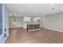 Open-concept kitchen with an island and modern appliances in a spacious living area at 2478 Graywall St, East Point, GA 30344