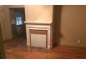 Cozy room featuring a decorative fireplace and hardwood floors providing a comfortable space at 1840 Madrona Nw St, Atlanta, GA 30318