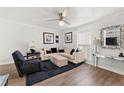 Cozy living room with a comfortable sectional sofa, modern décor, and ample natural light at 204 Summer Pl, Norcross, GA 30071