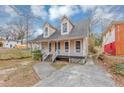 Charming two-story home with a welcoming front porch and well-maintained yard, perfect for relaxing outdoors at 2223 Wingate Sw St, Atlanta, GA 30310