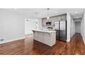 Open floor plan featuring modern kitchen island with stainless steel appliances at 1889 Cannon St, Decatur, GA 30032