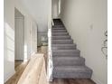 Inviting entryway with durable wood flooring and a staircase leading to the upper level at 858 Heritage Valley Rd, Norcross, GA 30093