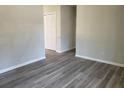 A spacious living room with attractive gray wood-look flooring at 159 Cedar Ridge Trl, Lawrenceville, GA 30046