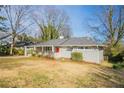 Charming one-story home featuring a covered entrance, grey paint, and a well-maintained front yard at 3449 Hyland Dr, Decatur, GA 30032