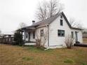 Side view of charming home showing a small deck and a grassy yard at 2084 North Rd, Snellville, GA 30078