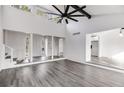 Bright living room with vaulted ceilings, modern ceiling fan, and stylish gray floors at 2412 Renny Ct, Marietta, GA 30066