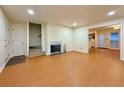 Open-concept living room with fireplace, staircase, and view into the kitchen at 3533 Mulberry Way, Duluth, GA 30096