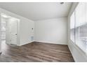 Well-lit living space featuring gray flooring, complemented by large windows and neutral walls at 4282 Worth Nw St, Acworth, GA 30101