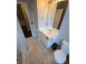 Bright bathroom with modern vanity, toilet, and neutral tile flooring at 3121 Baywood Ct, Conyers, GA 30013