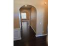 Inviting home entryway with wood floors, archway, and decorative wall details at 3121 Baywood Ct, Conyers, GA 30013