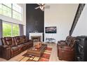Spacious living room features large windows, fireplace and hardwood floors at 2133 Creekview Trl, Decatur, GA 30035