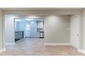 Open-concept living space featuring wood-look flooring leading into the kitchen with stainless steel appliances at 3761 Turner Heights Dr, Decatur, GA 30032