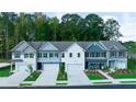 Charming new construction townhomes featuring varied colors and attached garages at 541 Tuskegee St, Mcdonough, GA 30253