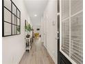 Bright entryway with light wood floors and decor at 549 Tuskegee St, Mcdonough, GA 30253