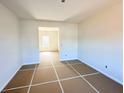 Bright, unfinished living room featuring clean white walls and abundant natural light, awaiting your personal touch at 66 Pine Creek Ct, Dallas, GA 30157