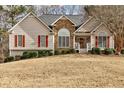 Charming single-Gathering home with a well-manicured lawn and inviting front porch at 764 Whitby Dr, Douglasville, GA 30134