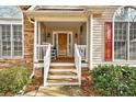 Inviting front porch features a seating area and decorative accents at 764 Whitby Dr, Douglasville, GA 30134