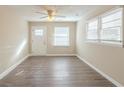 Bright and airy living room with stylish wood-look floors, a ceiling fan, and plenty of natural light at 858 Commodore Nw Dr, Atlanta, GA 30318