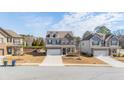 Beautiful two-story home featuring a brick facade, two-car garage, well manicured lawn, and a welcoming entrance at 433 Paden View Ct, Lawrenceville, GA 30044