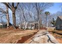 Inviting home with a well-maintained exterior and a long driveway at 1686 Terry Mill Se Rd, Atlanta, GA 30316