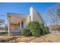 Cozy back porch of a charming home, featuring a classic railing and providing a welcoming outdoor space at 3423 Conley Downs Drive, Powder Springs, GA 30127