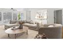 Bright living room with a large sectional sofa and modern decor at 1205 Gettysburg Pl, Sandy Springs, GA 30350