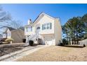 Well-kept two-story home featuring a manicured front yard and ample parking at 4415 Roche St, Atlanta, GA 30349