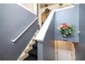 Staircase with carpeted steps and neutral-colored walls at 4415 Roche St, Atlanta, GA 30349