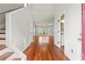 Bright entryway with hardwood floors, a staircase, and views into the living area at 2829 Priestcliff Se Dr, Smyrna, GA 30080