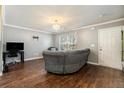 Comfortable living room with hardwood floors and a modern ceiling light at 5987 Westchase St, Atlanta, GA 30336