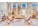 Bright living room boasts hardwood floors, exposed brick, and designer furnishings at 650 Glen Iris Ne Dr # 15, Atlanta, GA 30308