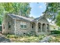 Stone house featuring an arched entryway leading to the front door at 1110 Asbury St, Oxford, GA 30054