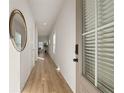 Light and airy hallway featuring wood floors and modern decor creates a welcoming entrance at 228 Epping Street # 8, Stockbridge, GA 30281