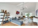 Bright living room with vaulted ceilings, modern lighting, and hardwood floors at 2680 Braithwood Ne Rd, Atlanta, GA 30345