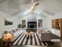 Bright, staged living room with vaulted ceilings, fireplace, and modern furnishings at 5926 Brassie Ridge Ln, Ellenwood, GA 30294