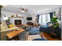 Cozy living room with fireplace, comfortable seating, and plenty of natural light at 4970 Lost Mountain Nw Trce, Kennesaw, GA 30152