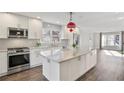 Beautiful open kitchen featuring stainless steel appliances and a large island with granite countertops at 734 Olde Towne Ln, Marietta, GA 30068