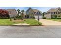 Charming two-story home with stone and siding, manicured lawn, and a two-car garage at 820 Nob Ridge Dr, Marietta, GA 30064