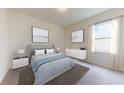 Stylish bedroom with a comfortable bed, contemporary decor, and lots of natural light at 146 Silverton Dr, Dacula, GA 30019