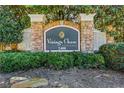 Vinings Chase Condominiums sign surrounded by lush greenery and a stone border at 2400 Cumberland Se Pkwy # 212, Atlanta, GA 30339