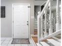 Bright foyer featuring a white door, tile floors and a staircase at 134 Springstead Ct, Marietta, GA 30060