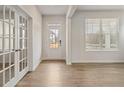 Bright foyer with hardwood flooring, glass french doors, and large windows, creating a welcoming entrance at 801 Dobby Way (Lot 92), Mcdonough, GA 30252