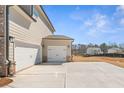 Attached two-car garage on a spacious lot with ample parking space at 816 Dobby Way (Lot 100), Mcdonough, GA 30252