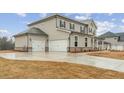 Spacious two-car garage with a concrete driveway, complementing the home's exterior and providing ample parking at 267 Arwen Drive (Lot 66), Mcdonough, GA 30252